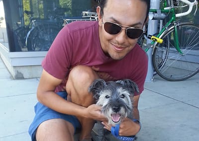 Hugging Slabtown's Bandit the Schnauzer