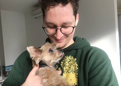 Cradling Mimi the yorkshire terrier